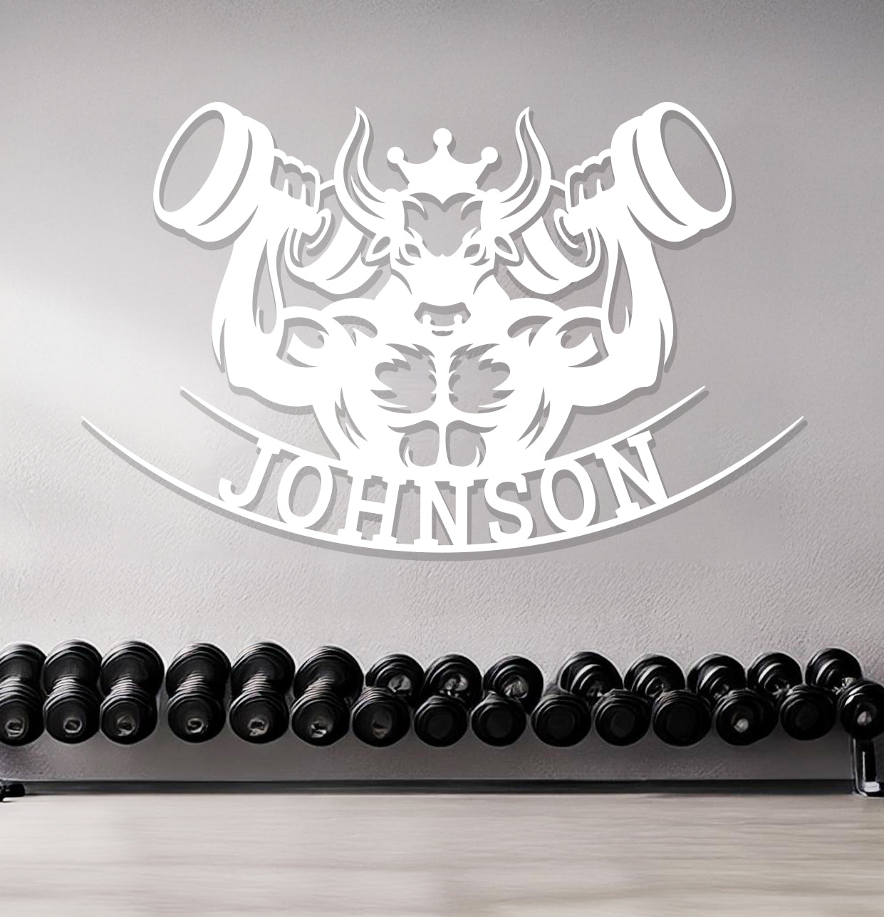 a gym with dumbs and a sign that says johnson