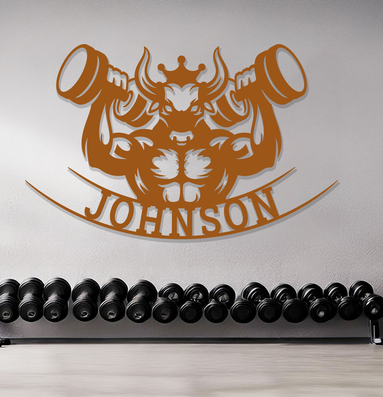 a gym with a wall sign and a row of dumbbells