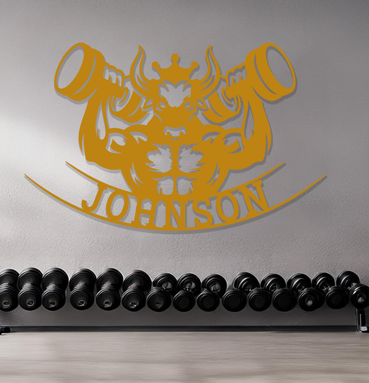 a gym with a row of kettles and a wall with a personalized sign