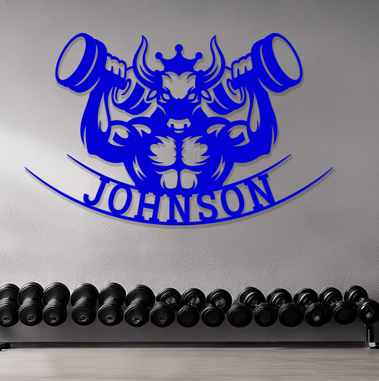a gym with dumbs and a sign that says johnson