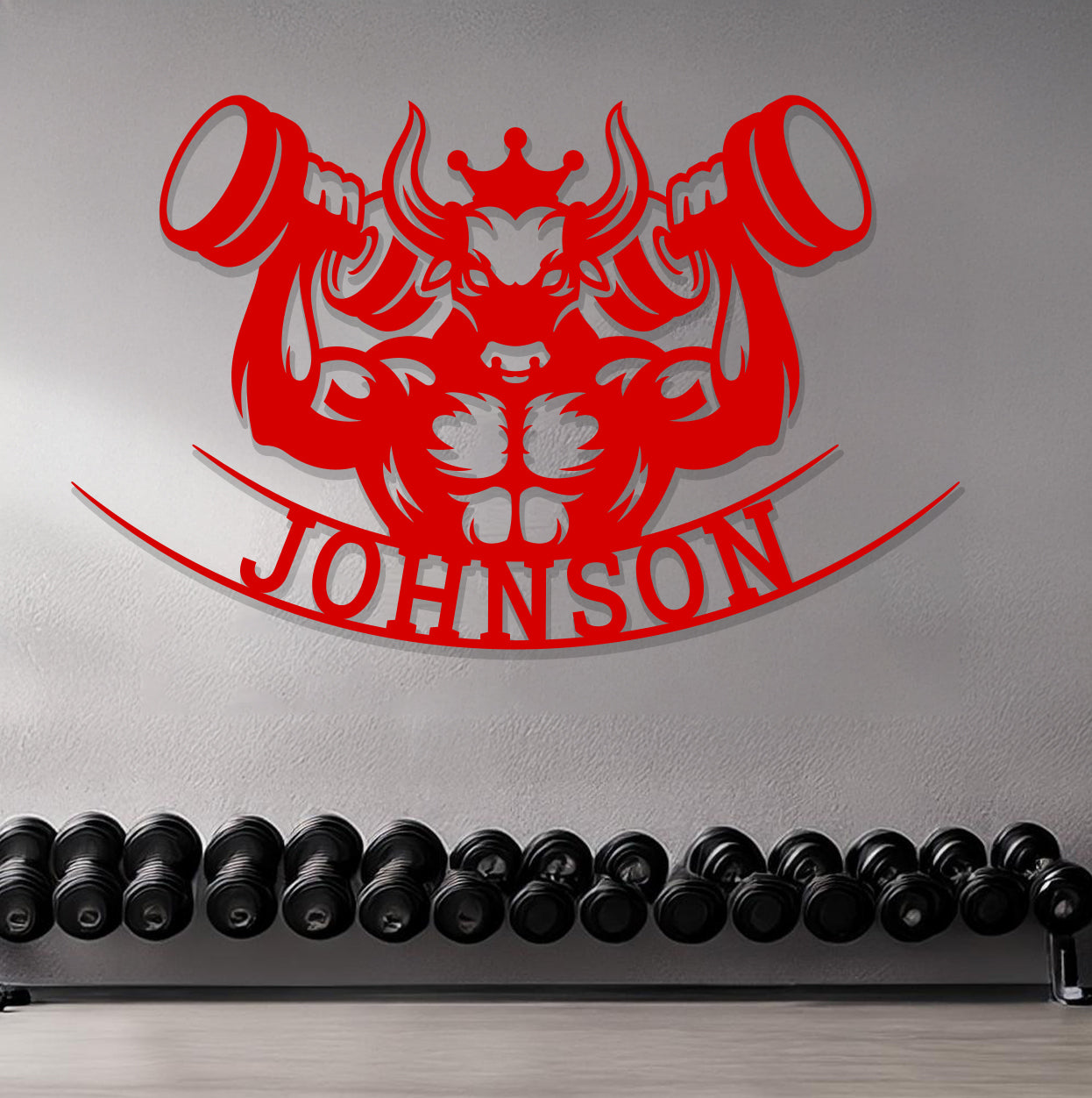 a gym room with a wall mounted sign and a row of dumbbells