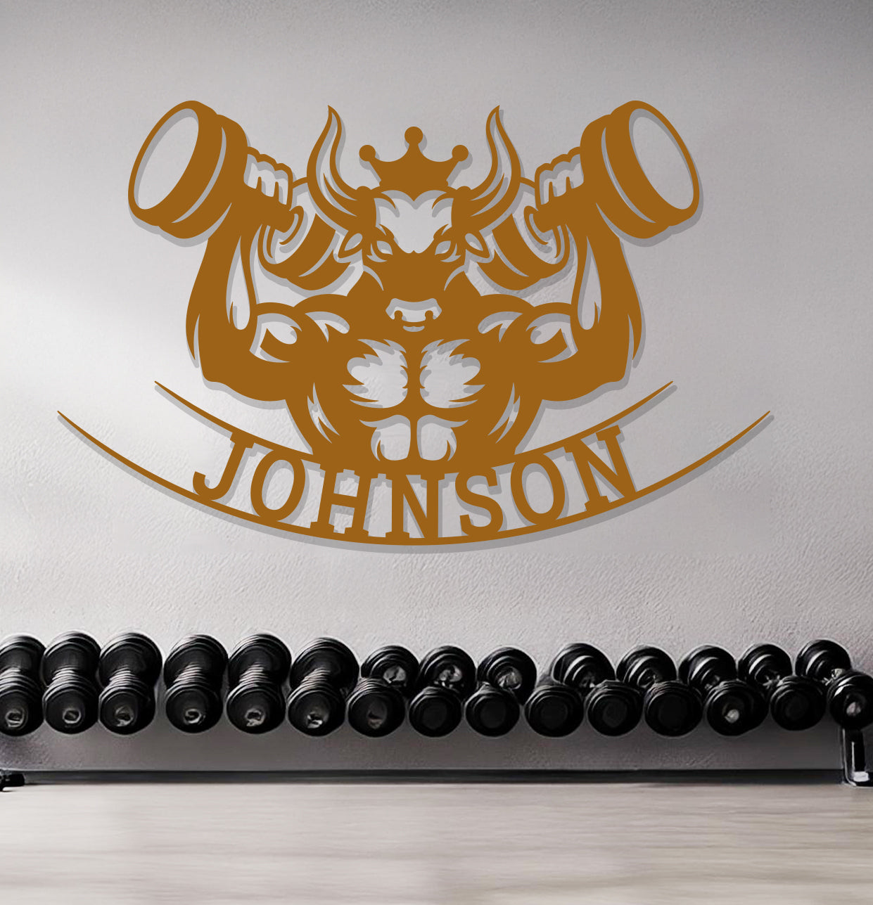 a gym with a wall sign and a row of dumbbells