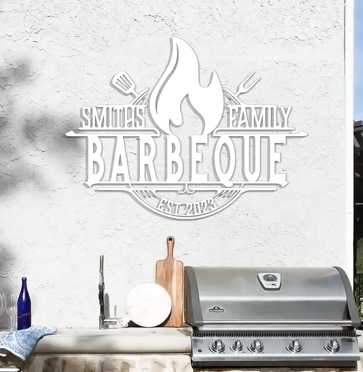 a bbq with a grill next to it and a bottle of wine