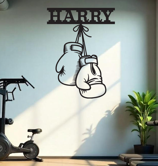 a wall decal with a pair of boxing gloves hanging from a hook